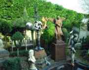architectural garden display with gargoyle and statues